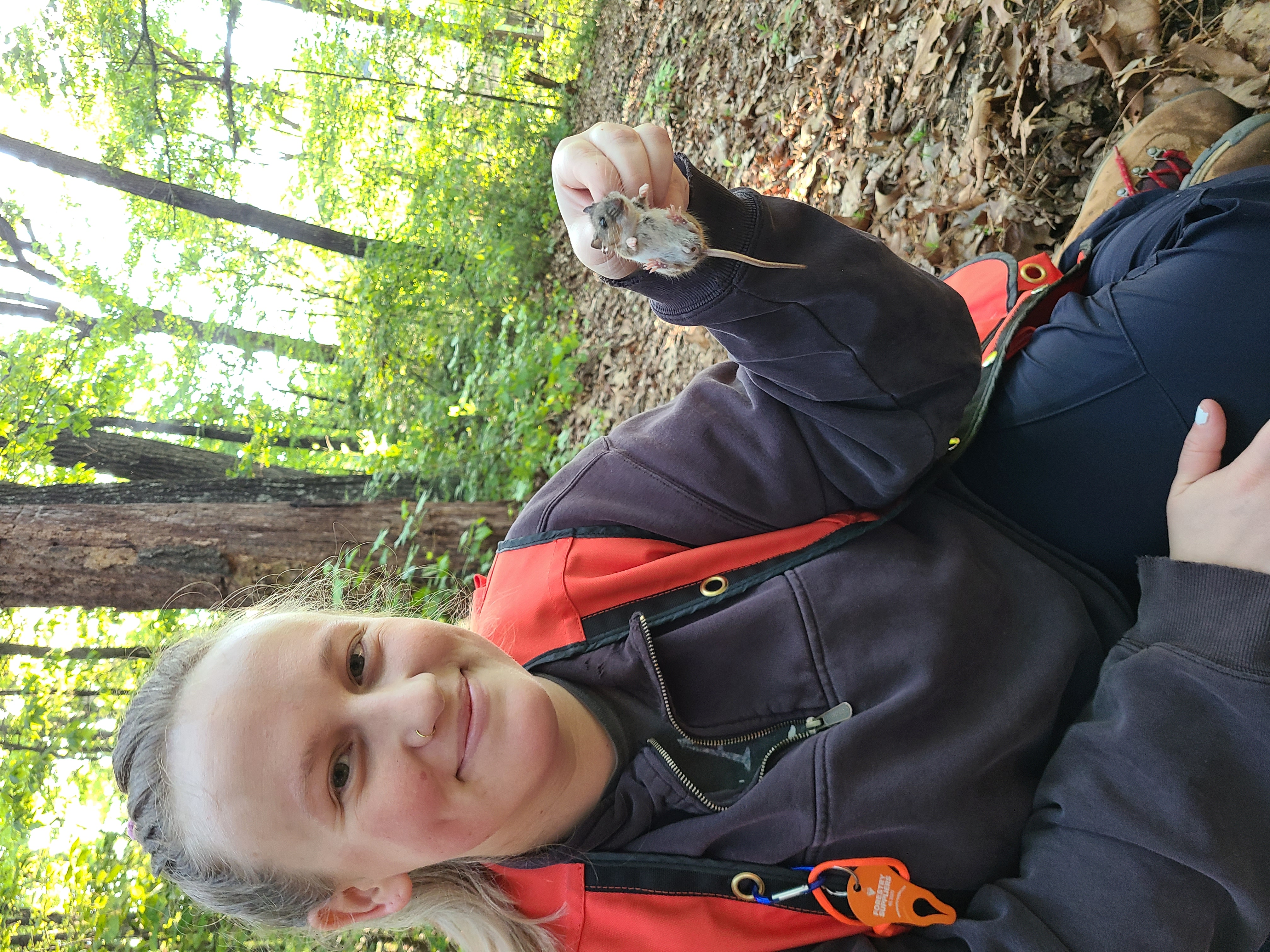Sydney Morton holding a mouse.